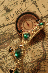Luxury watch and crown on an ancient map - 775750293