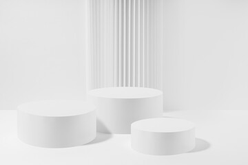 Three white round podiums with striped column as geometric decor, mockup on white background. Template for presentation cosmetic products, gifts, goods, advertising in contemporary black friday style.