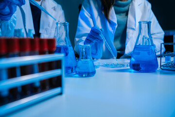 biotechnologist testing new chemical substances in a laboratory.