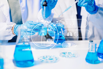 Female scientist researcher conducting an experiment working in chemical laboratory. Scientist team...