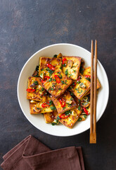 Fried tofu with peppers, garlic and herbs. Vegetarian food. Healthy eating. Diet.