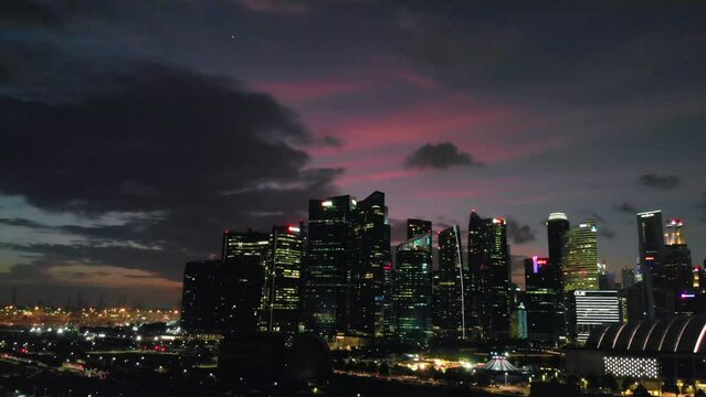 SINGAPORE - JANUARY 3, 2019: Aerial view of Marina Bay and city skyline from Gardens by the Bay at twilight
