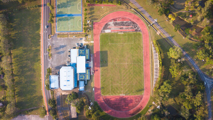 Aerial Top Down View of Soccer Football Field and Two Amateur Teams Playing. Passing, Dribbling,...