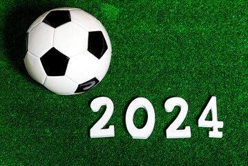 A soccer ball next to a 2024 number