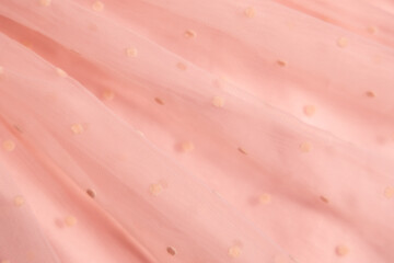 Gentle texture background soft pink color, textile pattern, pink polka dot on tulle, copy space