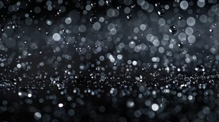 Fotobehang shimmering rain drop black background © paisorn
