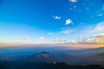Obraz premium Colorful majestic sunset sky with cloud on top of mountain nature landscape