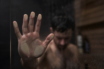 Human hands on shower glass - 775782070