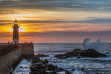 Fototapeta na wymiar Sunset over Atlantc Ocean, view with Felgueiras Lighthouse in Porto, Portugal