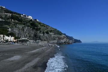Beautiful view of the Amalfi coast in the province of Salerno, Italy under a bright blue sky