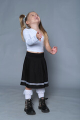 Child in mid-twirl, her delight is infectious. Emphasizes the natural grace and exuberance of children at play.