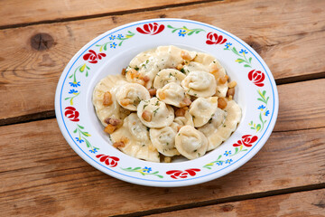 dumplings with potato on the wooden background - 775798236