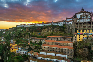 Fototapeta premium Sunrise sky above Serra do Pilar Monastery and Port Wine cellars in Vila Nova de Gaia, Portugal