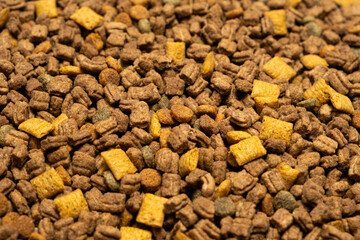 Dry food for puppies close-up. Complete diet for dogs during their first year of life