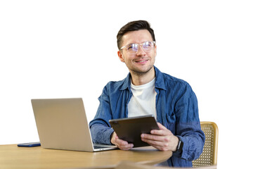 A male student studying online education uses a laptop and tablet. Isolated transparent background.