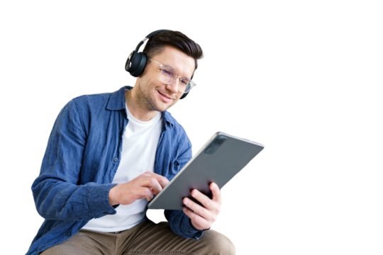 A male student studying online education uses a tablet. Isolated transparent background.