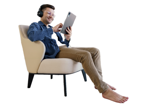 A male student studying online education uses a tablet and sits in a chair. Isolated transparent background.