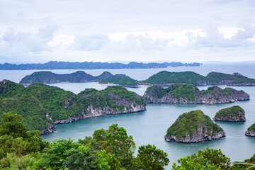 beautiful limestone rocks and secluded beaches in Ha Long bay, UNESCO world heritage site, Vietnam - 775808446