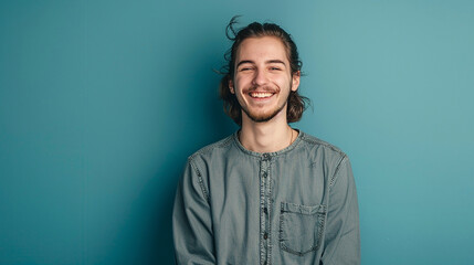 Natural and handsome young man posing against a color solid background - obrazy, fototapety, plakaty