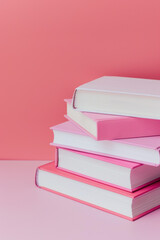 books on a pink plain background. Knowledge day, back to school