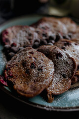 pancakes with raspberries in white plate