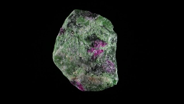 Anyolite - Green Zoisite with Ruby (from Tanzania) rotating slowly against a black background.