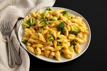 Homemade Cheesy Chicken And Broccoli Pasta on a Plate, side view.