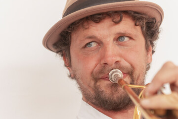 Determined musician practicing trumpet