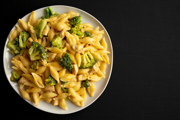 Homemade Cheesy Chicken And Broccoli Pasta on a Plate, top view. Copy space.