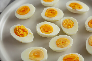 Cooked Hard Boiled Eggs on a Plate, side view.