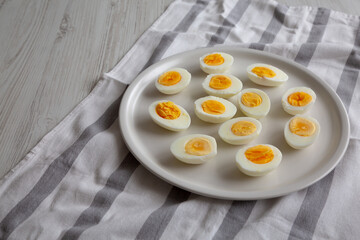 Cooked Hard Boiled Eggs on a Plate, side view. Copy space.