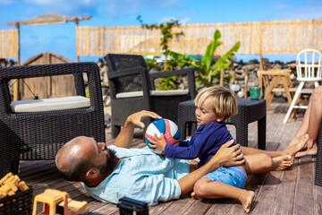 Family living in a van enjoys deck life with garden