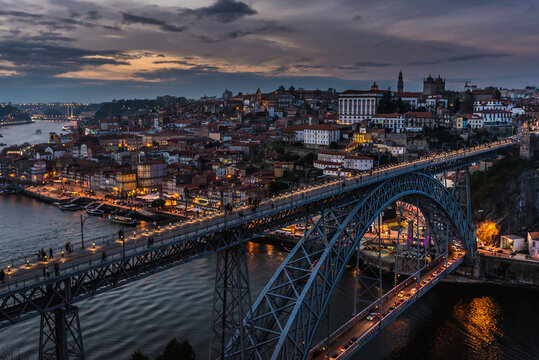 Evening view of Dom Luis I Bridge in Porto, view from Serra do Pilar viewpoint in Vila Nova de Gaia, Portugal