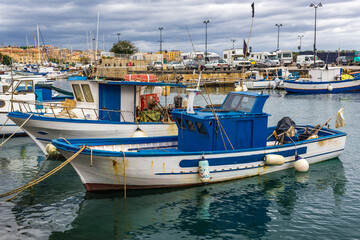 Fishing boats in port of Syracuse historic city, Sicily Island, Italy