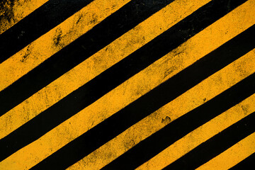 Grunge Warning sign yellow and black surface as Warning or Danger Pattern. Concrete wall for do not enter the area