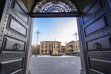 View from gate of City Hall with Elephant Fountain and Palace of Seminary of Clerics in Catania,...