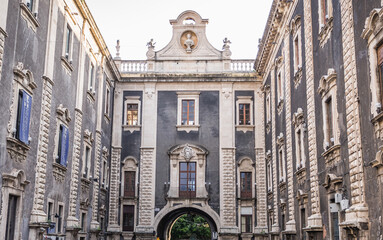 Porta Uzeda gate next to Palace of Seminary of Clerics in historic part of Catania, Sicily Island,...