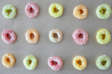 Top view of Colorful Fruit Loops Cereal in Row