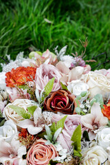 Beautiful outdoor weeding decoration made of artificial flowers. Traditional romantic motifs.