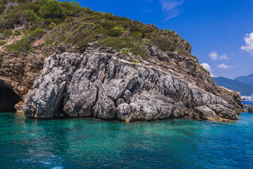Tourist swimming next to Sveti Nikola Island near Budva town, Adriatic coast, Montenegro