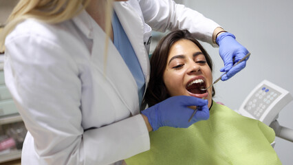 Beautiful, young woman having a checkup at the dentist's