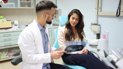 Dentist and his patient working on planning treatment together