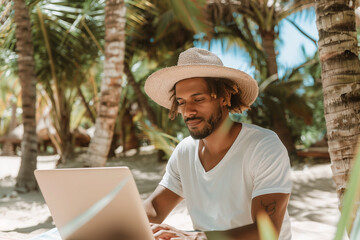 Fototapeta premium Man working with computer at tropical beach on his vacation. Freelance, work from anywhere concept