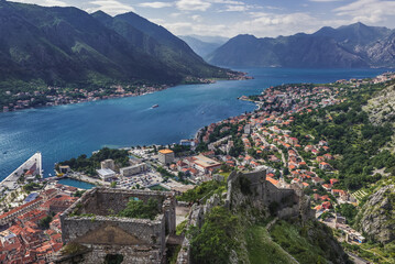 Fototapeta na wymiar Historic Old Town city walls around St John Fortress in Kotor town, Montenegro