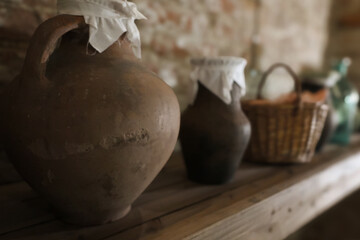Old pantry with materials, foods and containers from long ago. Larder in the old farmhouse - obrazy, fototapety, plakaty