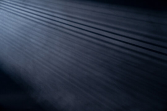Light rays coming through the blinds isolated on black background with copy space