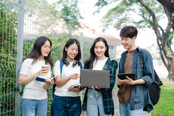 Diverse group of young adults from Asia and beyond, enjoying university life together. happy,...