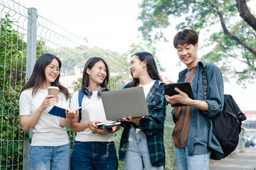 Diverse group of young adults from Asia and beyond, enjoying university life together. happy,...