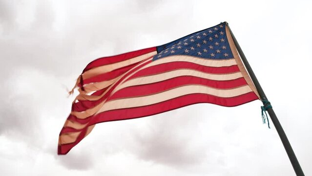 American flag against the cloudy sky