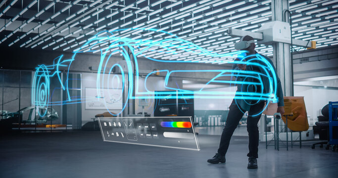 African Automotive Engineer Wearing a Virtual Reality Headset, Using Controllers to Work in Digital Software and Streamline a Blue Concept Sportscar. Digitalization Concept in Car Industry.